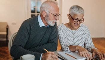 Elderly couple looking at finances