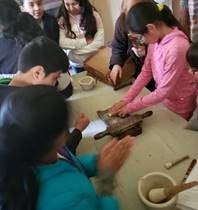 Children crafting at a table