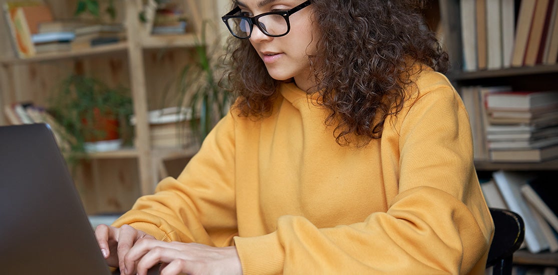 Student Paying Student Loan On Computer