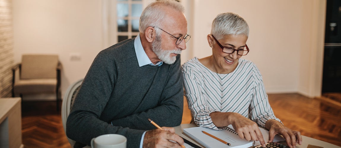 Elderly couple looking at finances