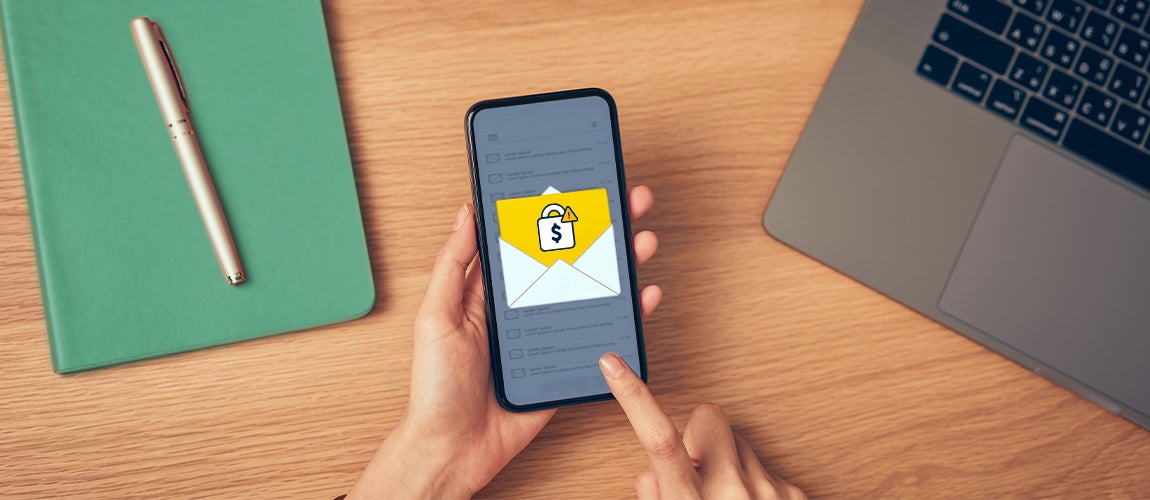 A smartphone being alerted of email fraud.