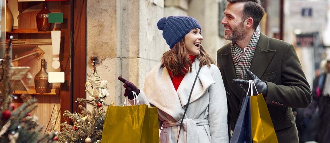 Couple shopping for the holidays using a holiday loan.