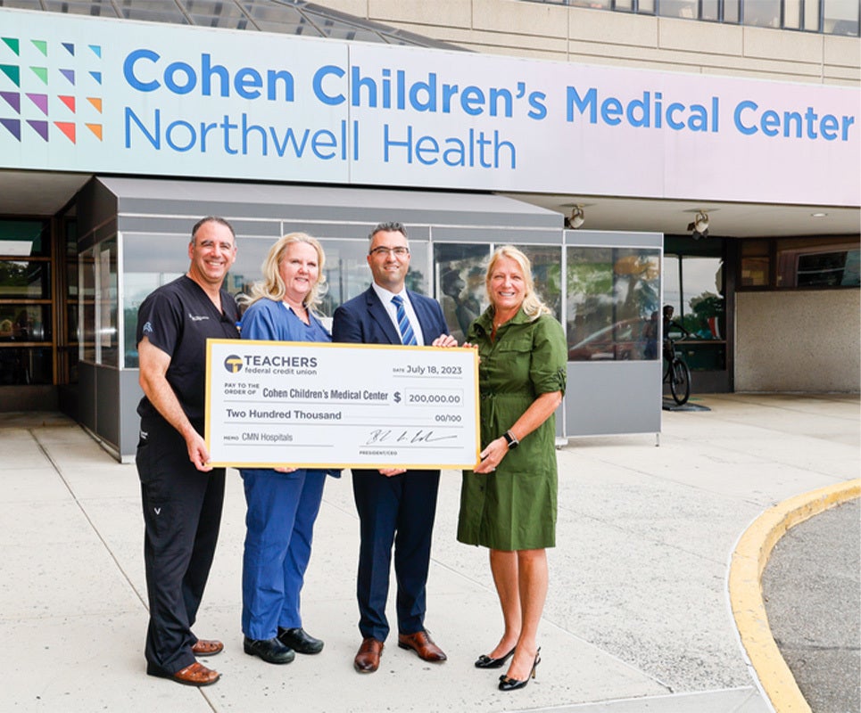 People holding a large check.