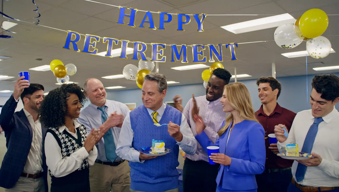 A group of people enjoy a retirement celebration