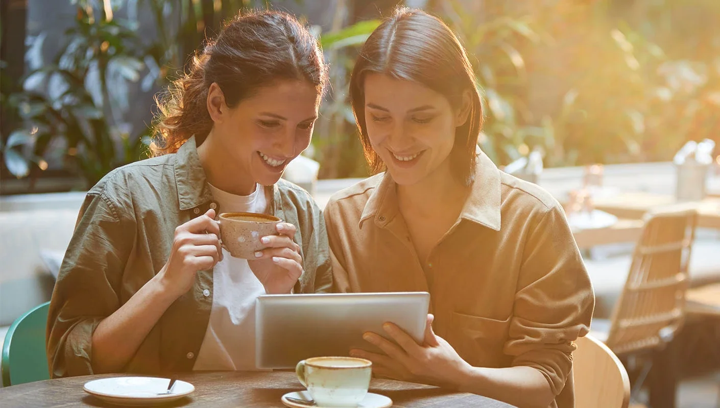 Two people sharing on an ipad