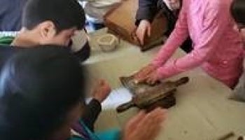 Children crafting at a table