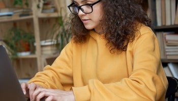 Student Paying Student Loan On Computer