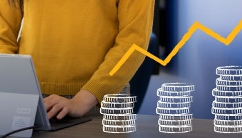 Woman with computer showing investment portfolio growth