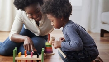 Woman educating kid on age to start savings