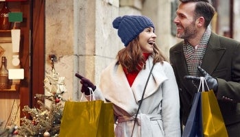 Couple shopping for the holidays using a holiday loan.