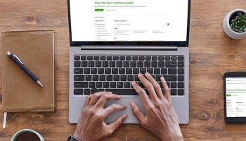 Person at laptop researching the best freelance jobs as a side hustle.