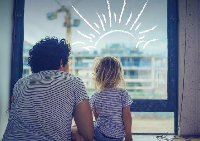 father and child looking out a window